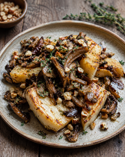 Baked celeriac with wild mushrooms, thyme and hazelnuts