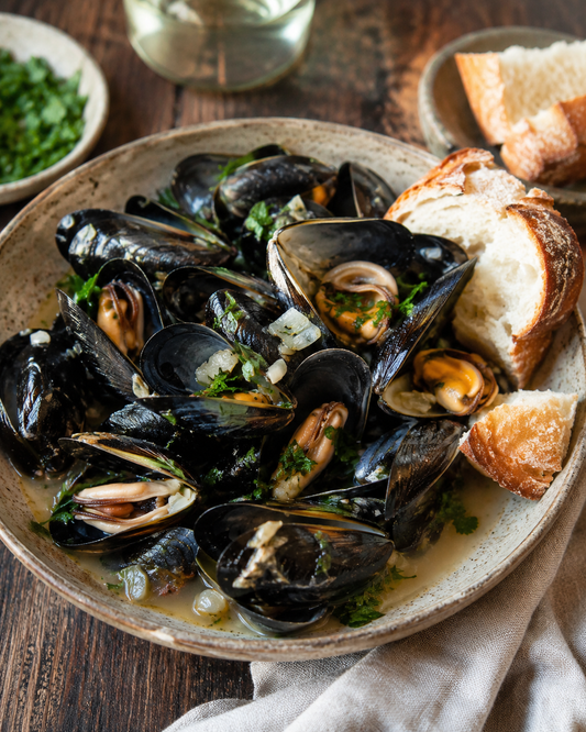 Moules marinières with crusty bread