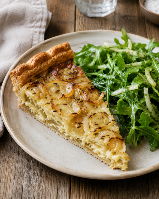 Onion tart with caraway and a green salad